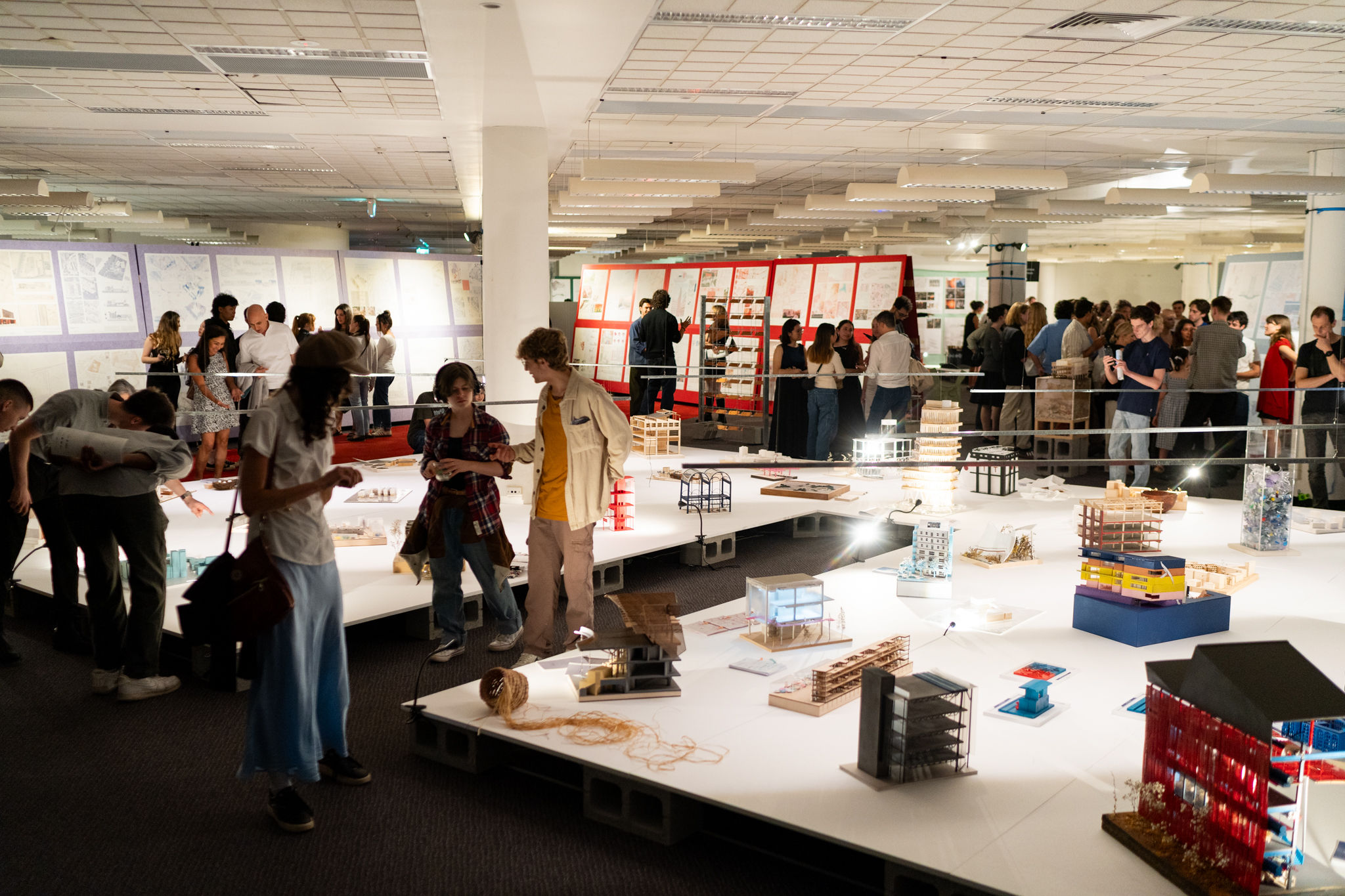 Colorful Acoufelt acoustic panels used as vertical display boards for student work at UTS architecture exhibition